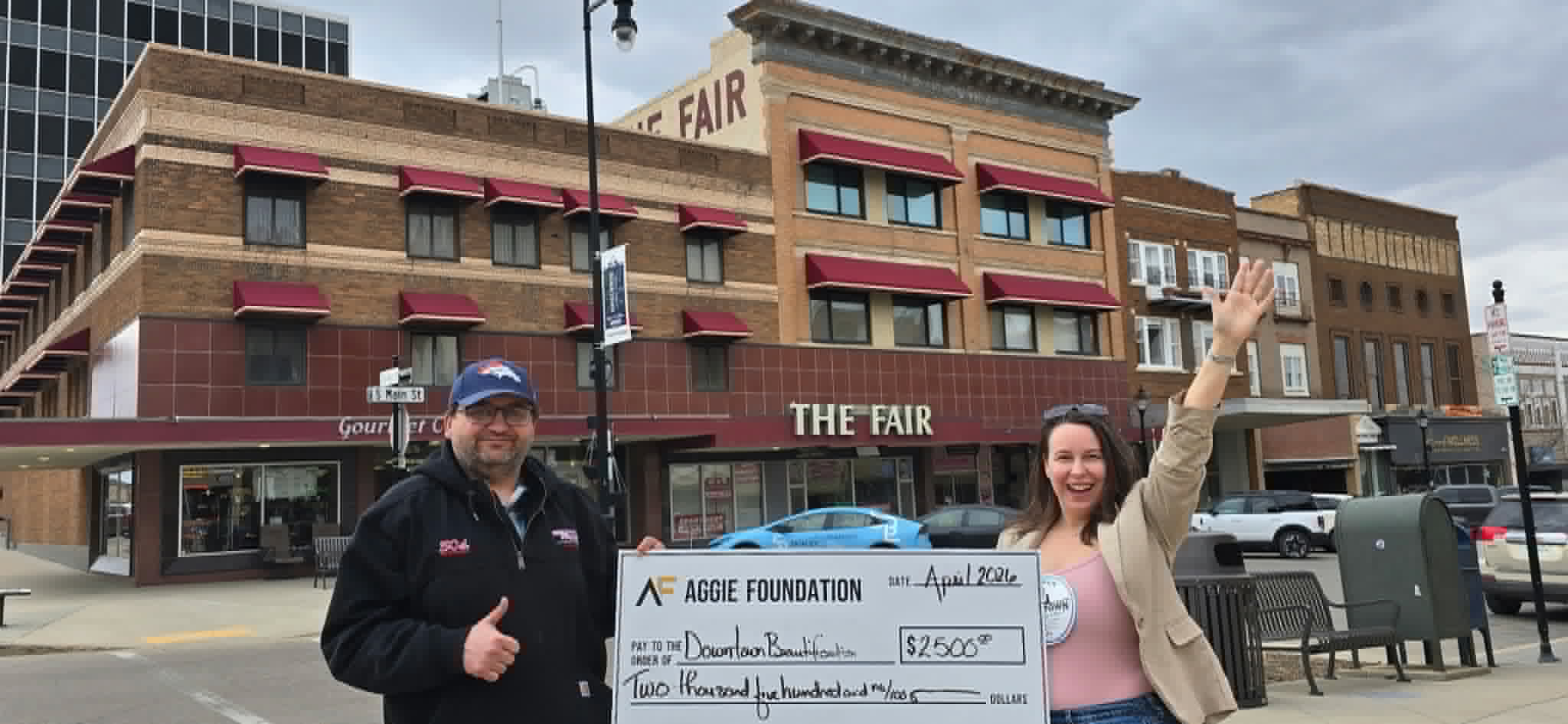 Christine Staley and Corey Long with a $2,500 Donation from the Aggie Foundation